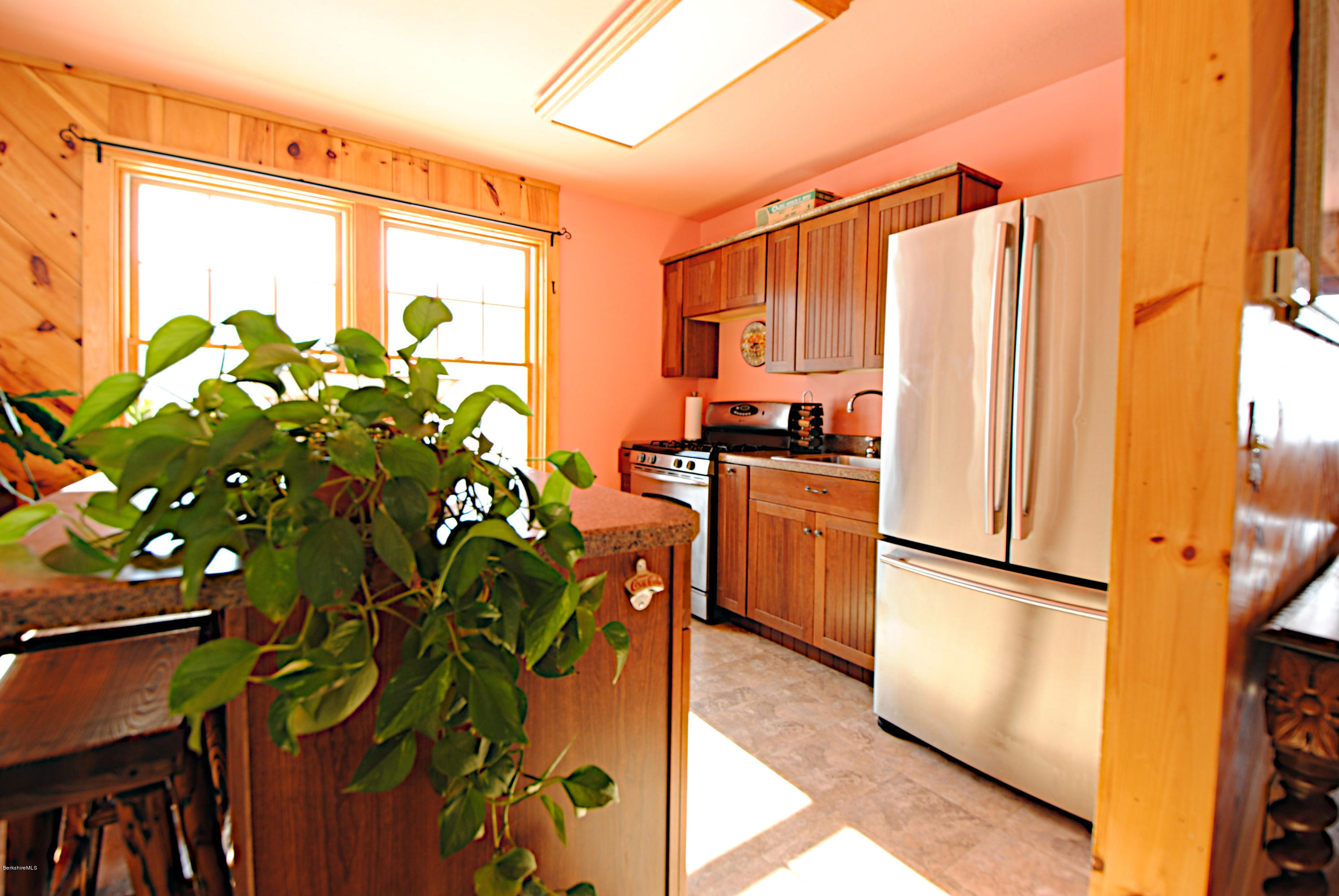 55 Maple Hill Road West Stockbridge, MA 01266 - Photo 34 of 63 a kitchen with stainless steel appliances a refrigerator a sink and a view of living room