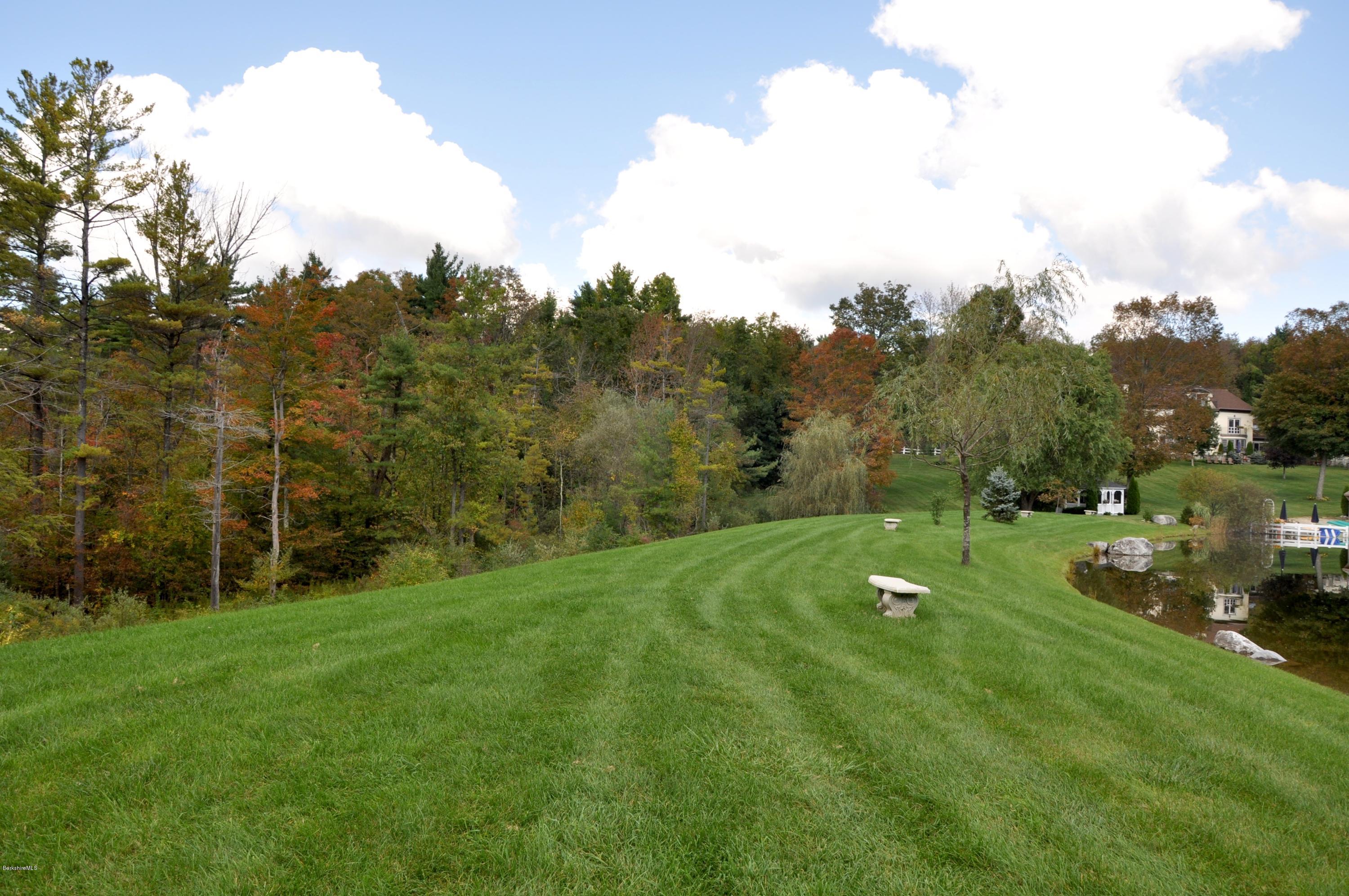 55 Maple Hill Road West Stockbridge, MA 01266 - Photo 50 of 63 a view of a golf course with a lake