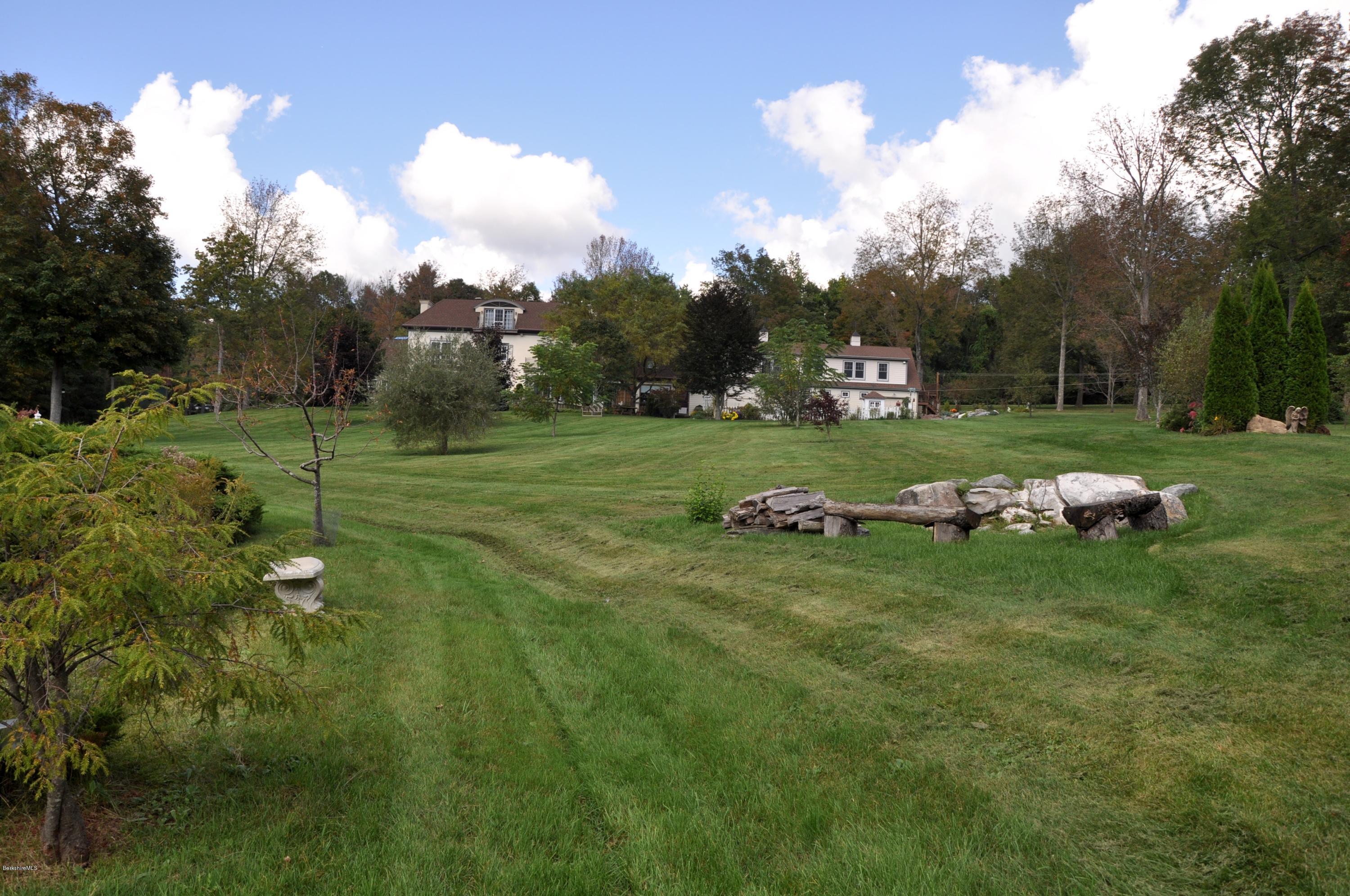 55 Maple Hill Road West Stockbridge, MA 01266 - Photo 54 of 63 a view of a field of grass and trees