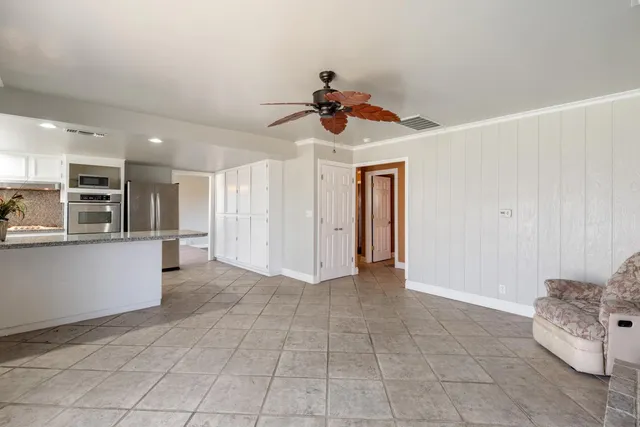 a view of kitchen with furniture and window