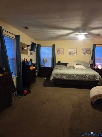 a bedroom with a bed and a closet