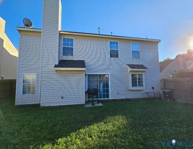 a brick building with a yard