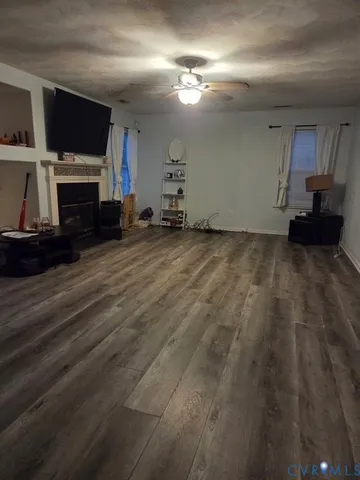 a view of a livingroom with furniture and a fireplace