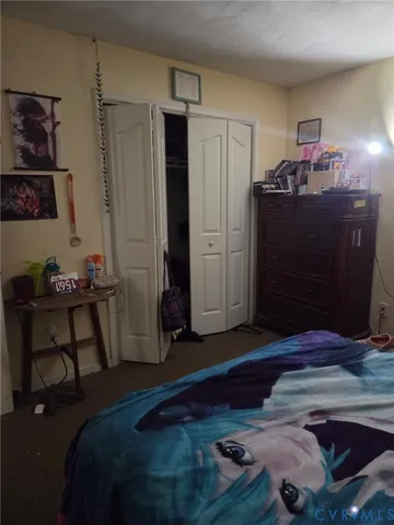 a bed room with a bed and a window