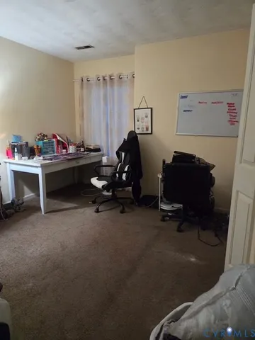 a view of a workspace with furniture