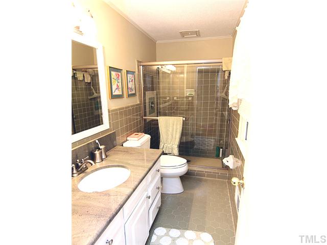 1608 Stonehurst Road Raleigh, NC 27607 - Photo 11 of 23 Master bath with new granite countertops and tile shower! Very nice.