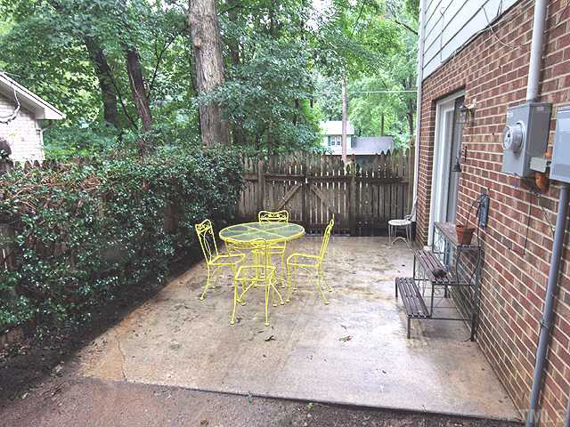 1608 Stonehurst Road Raleigh, NC 27607 - Photo 18 of 23 small private patio outside the living room.