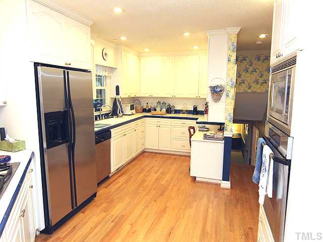 1608 Stonehurst Road Raleigh, NC 27607 - Photo 3 of 23 Hardwood floors, tile and stainless steel appliances!