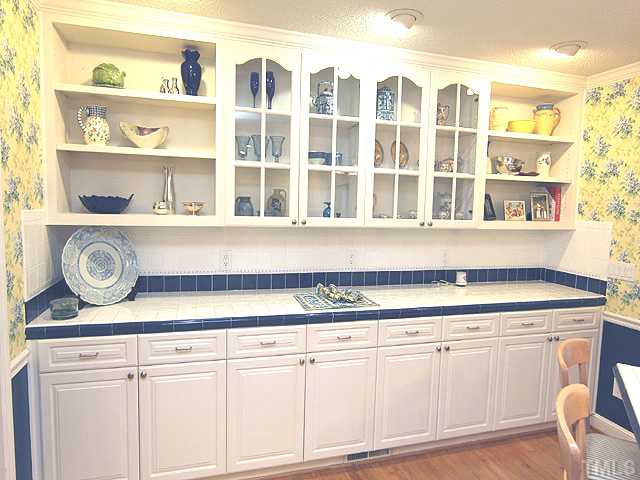 1608 Stonehurst Road Raleigh, NC 27607 - Photo 5 of 23 A place to show off your china and a place to hide all the pots and pans!