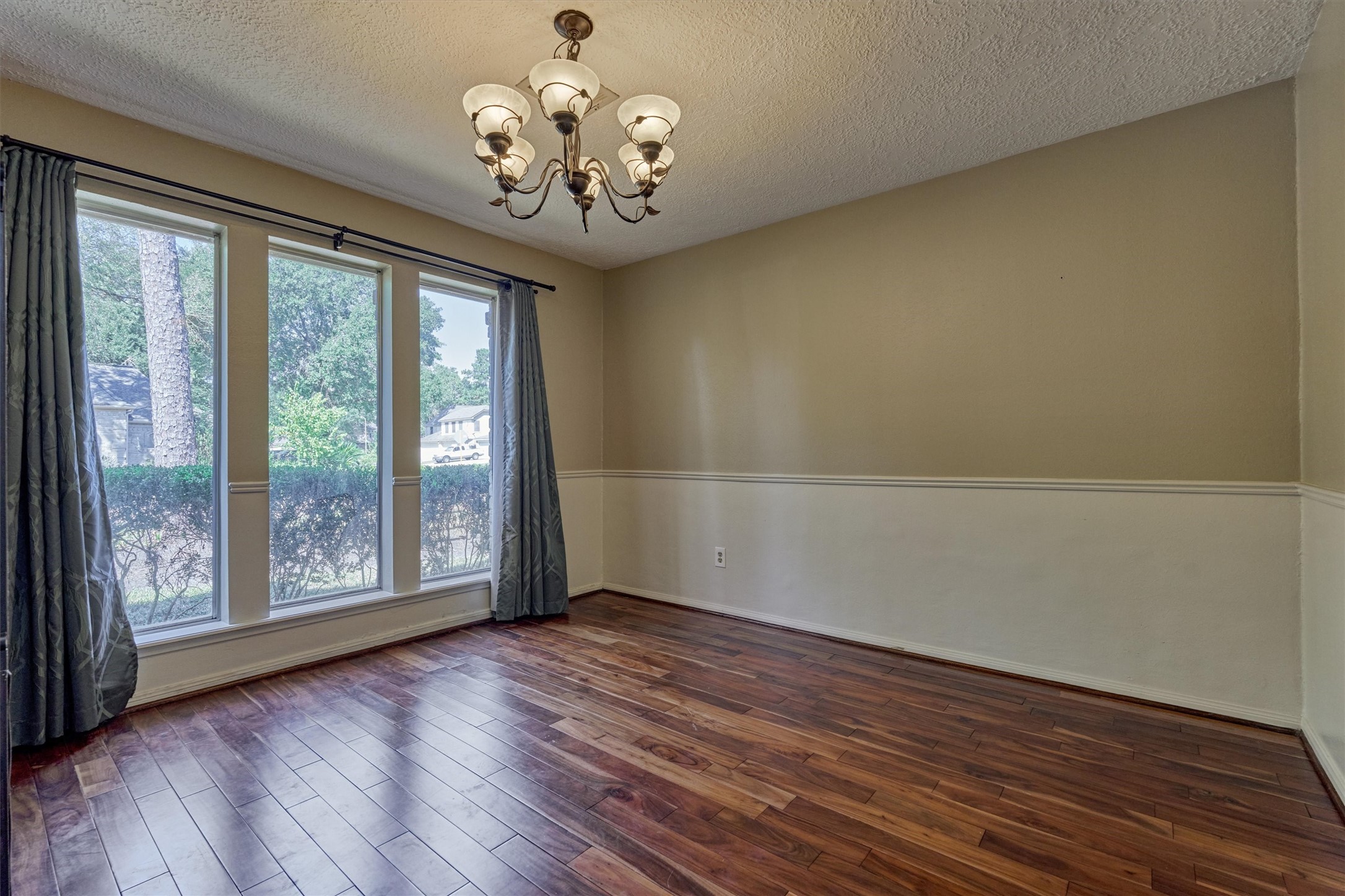 5503 Alamosa Lane Spring, TX 77379 - Photo 11 of 38 a view of an empty room with wooden floor and a window