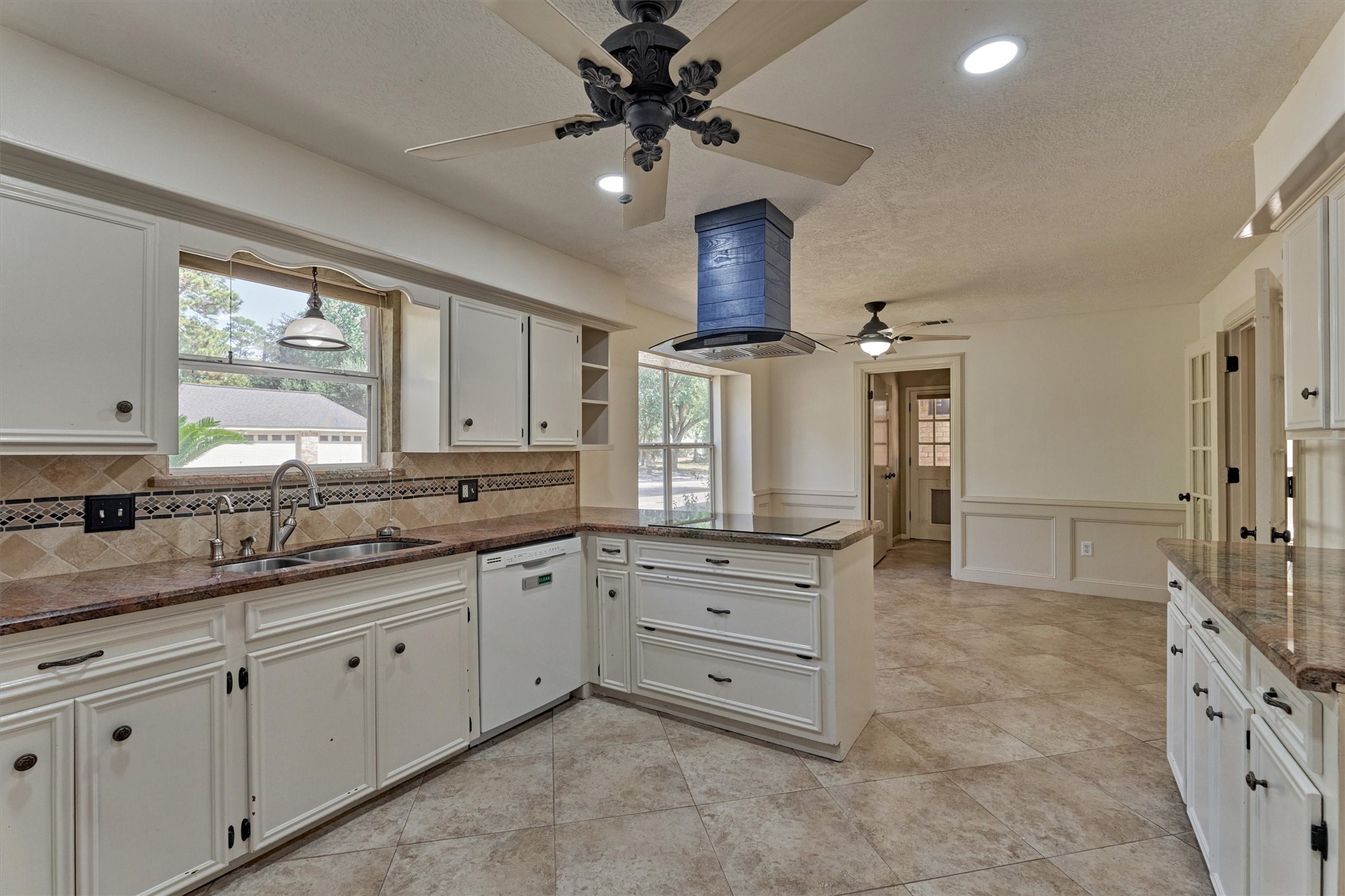 5503 Alamosa Lane Spring, TX 77379 - Photo 12 of 38 a kitchen with granite countertop a sink stainless steel appliances and cabinets