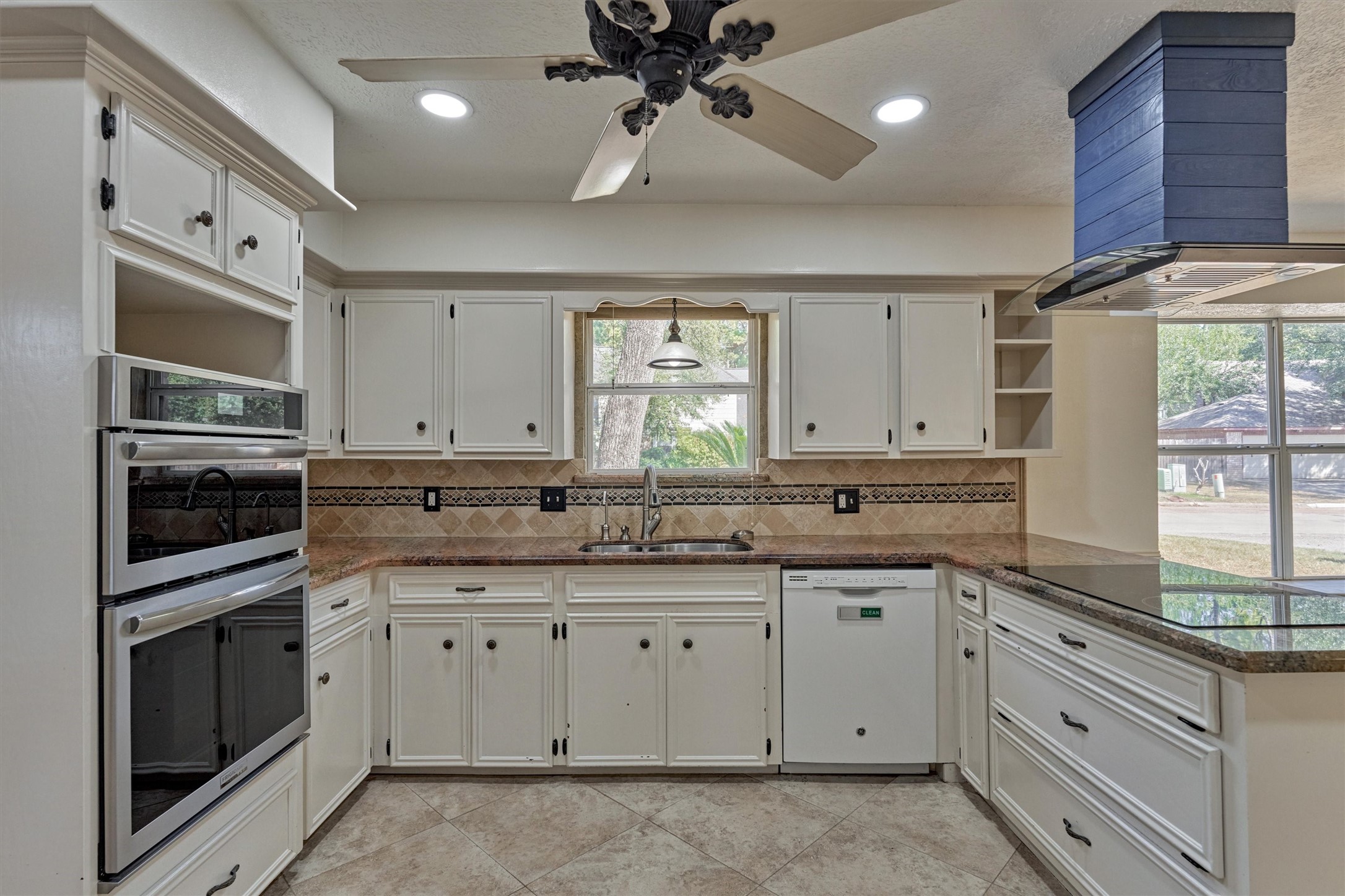 5503 Alamosa Lane Spring, TX 77379 - Photo 13 of 38 a kitchen with a sink stove and microwave
