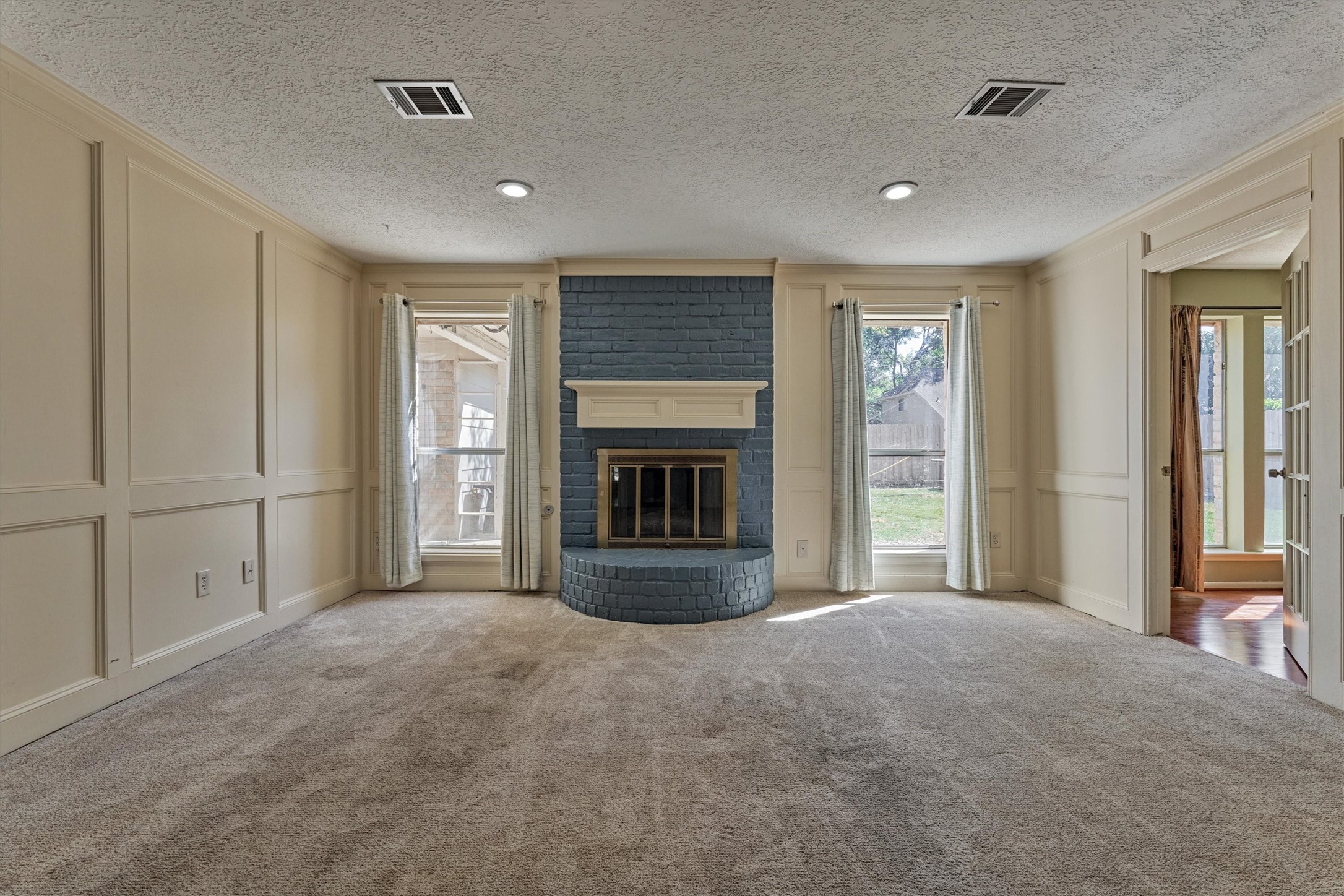 5503 Alamosa Lane Spring, TX 77379 - Photo 21 of 38 a view of an empty room with a fireplace and a window