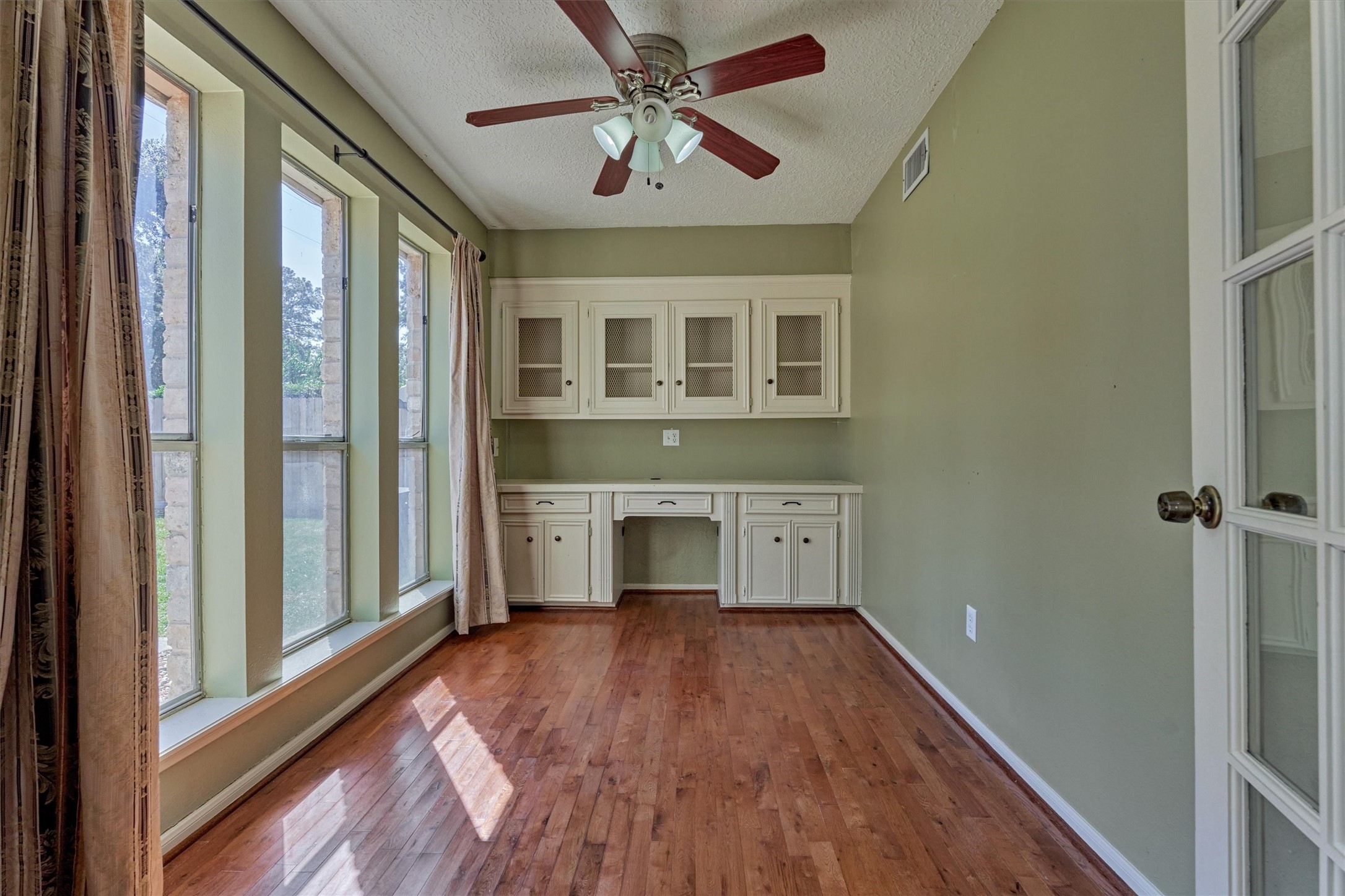 5503 Alamosa Lane Spring, TX 77379 - Photo 22 of 38 a view of empty room with wooden floor and fan