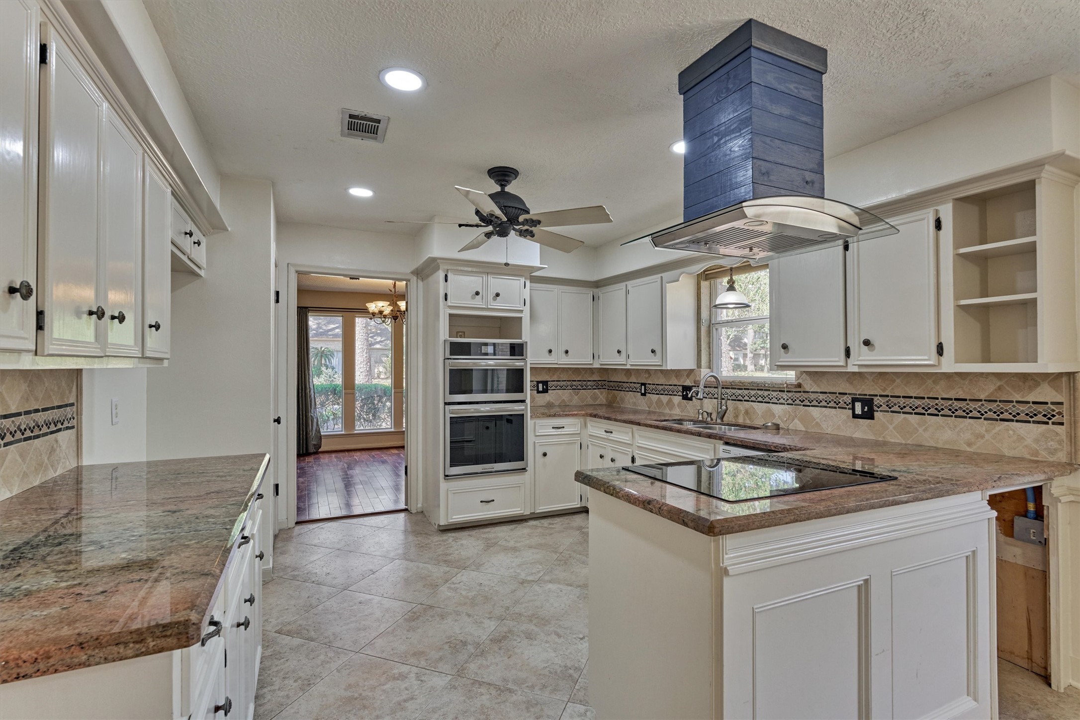 5503 Alamosa Lane Spring, TX 77379 - Photo 3 of 38 a kitchen with stainless steel appliances granite countertop a sink a stove and cabinets