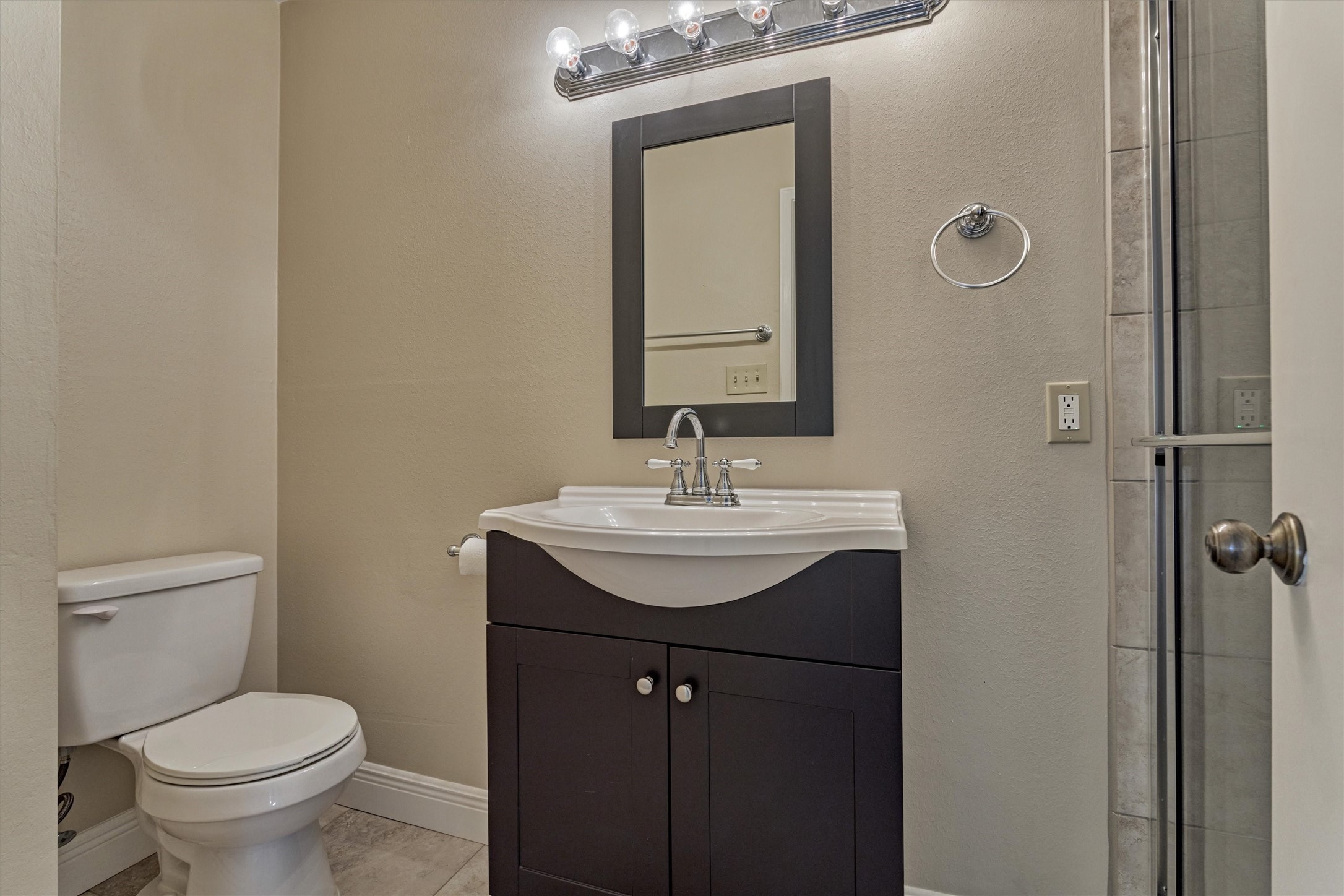 5503 Alamosa Lane Spring, TX 77379 - Photo 31 of 38 a bathroom with a sink toilet and mirror