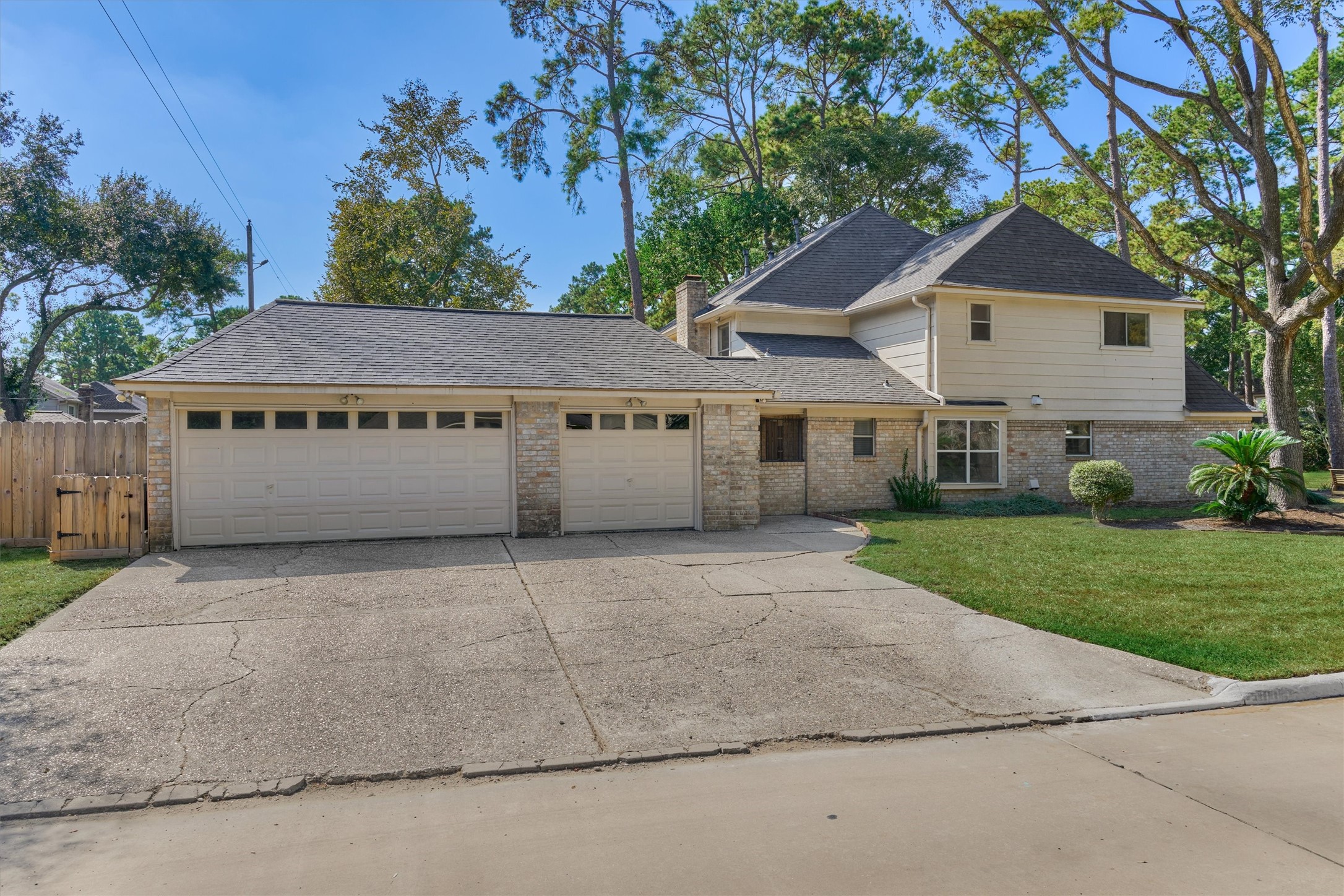 5503 Alamosa Lane Spring, TX 77379 - Photo 35 of 38 a front view of a house with a yard and garage