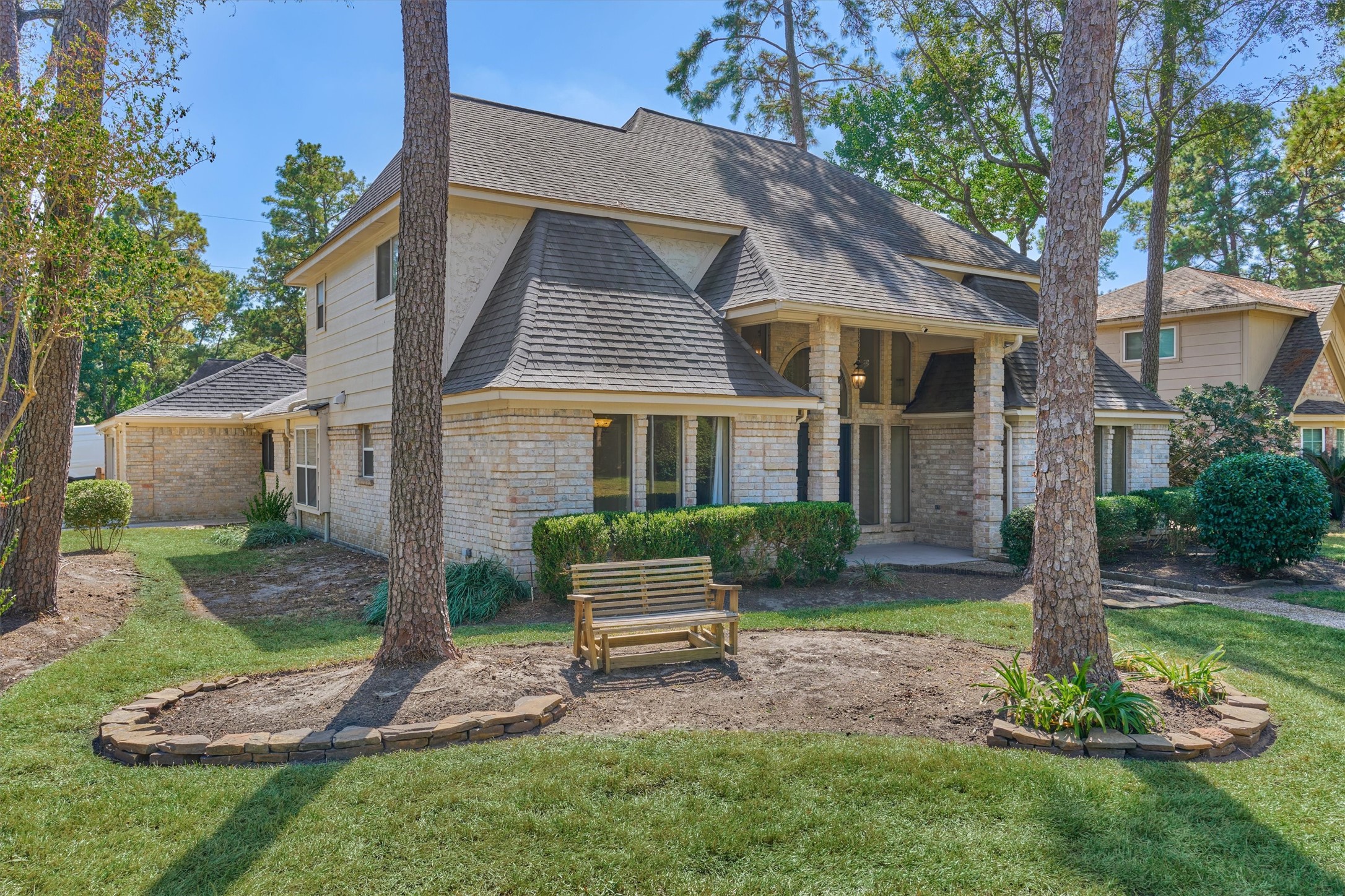 5503 Alamosa Lane Spring, TX 77379 - Photo 6 of 38 a front view of a house with a yard garden and outdoor seating