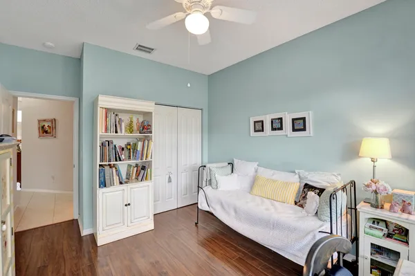 a living room with furniture and a lamp