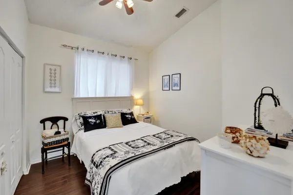 a bedroom with a bed and a chair