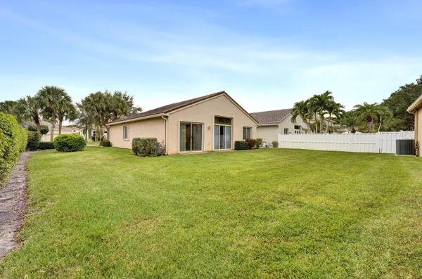 a view of a house with a yard and garage