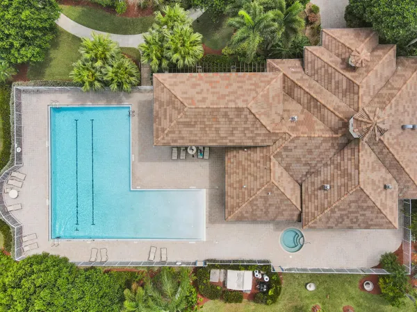 an aerial view of a house with yard