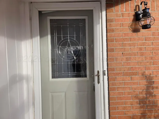 a kitchen with stainless steel appliances granite countertop a refrigerator sink and stove