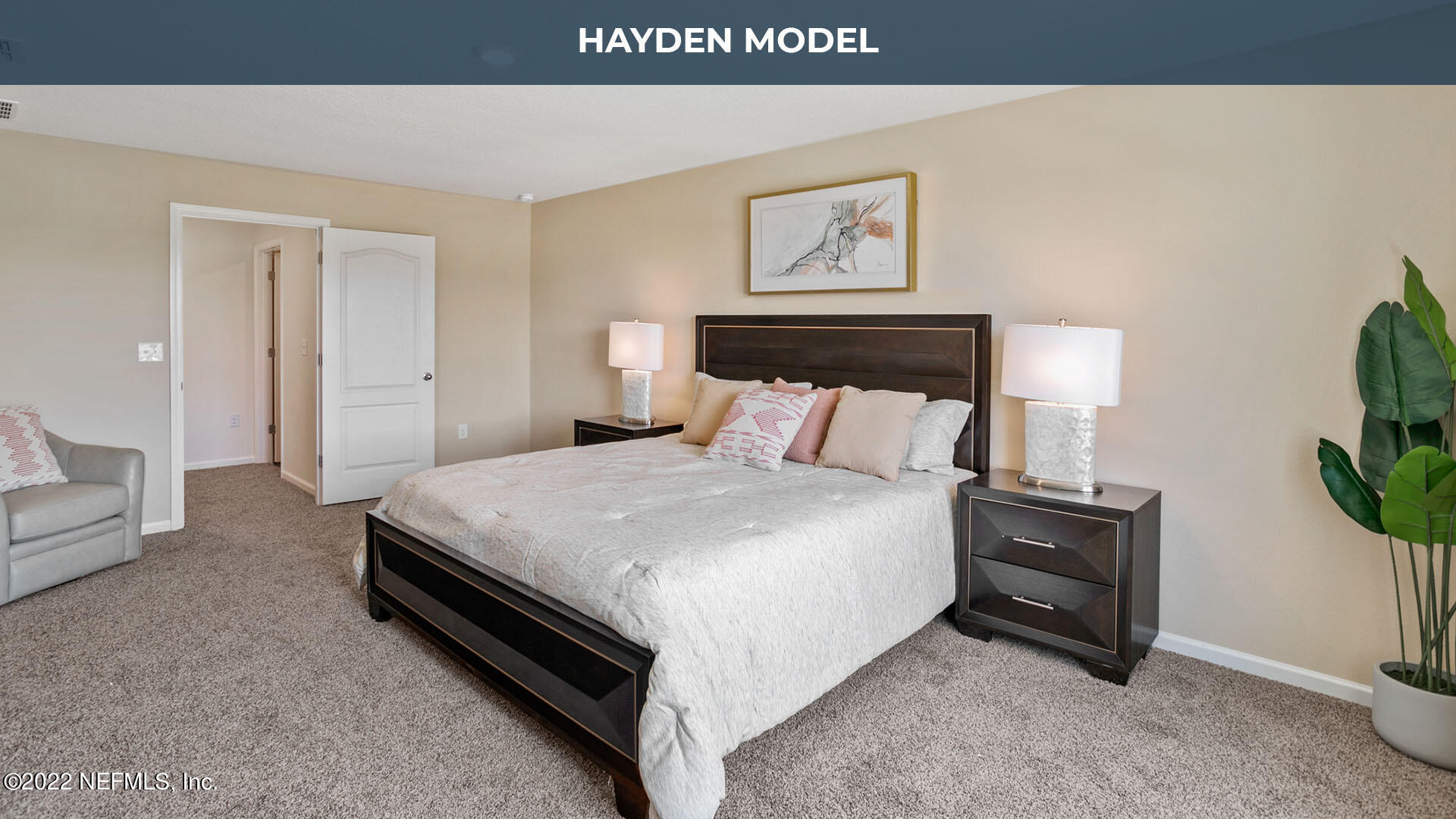 12648 European Beech Road Jacksonville, FL 32218 - Photo 11 of 37 a bedroom with a bed and a potted plant