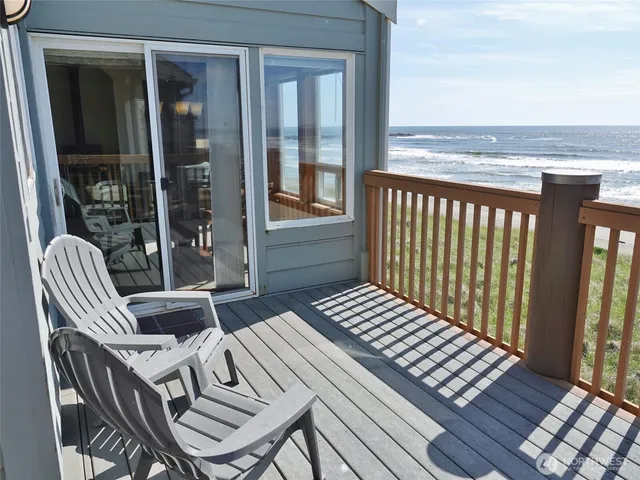 a view of balcony with wooden floor