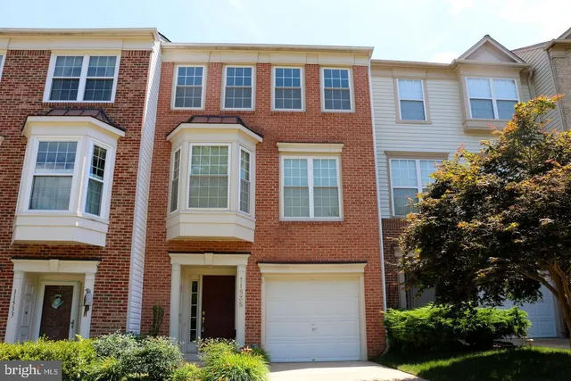 a front view of a house having yard