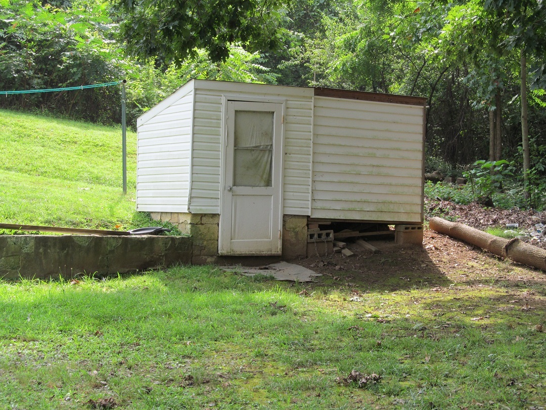 72 Clemons Road Roanoke, VA 24019 - Photo 10 of 15 a view of a backyard with plants and a lake view