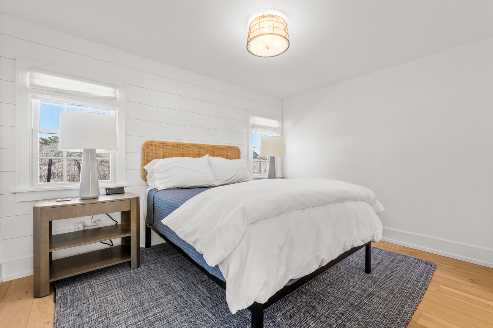 174 Cliff Road Nantucket, MA 02554 - Photo 40 of 49 a bedroom with a bed and a table
