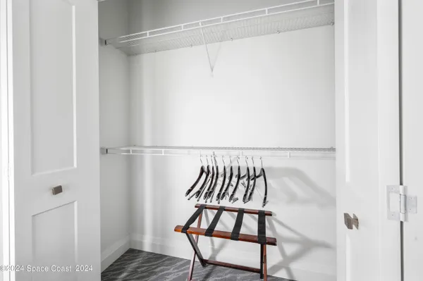 a large white bed in a white room