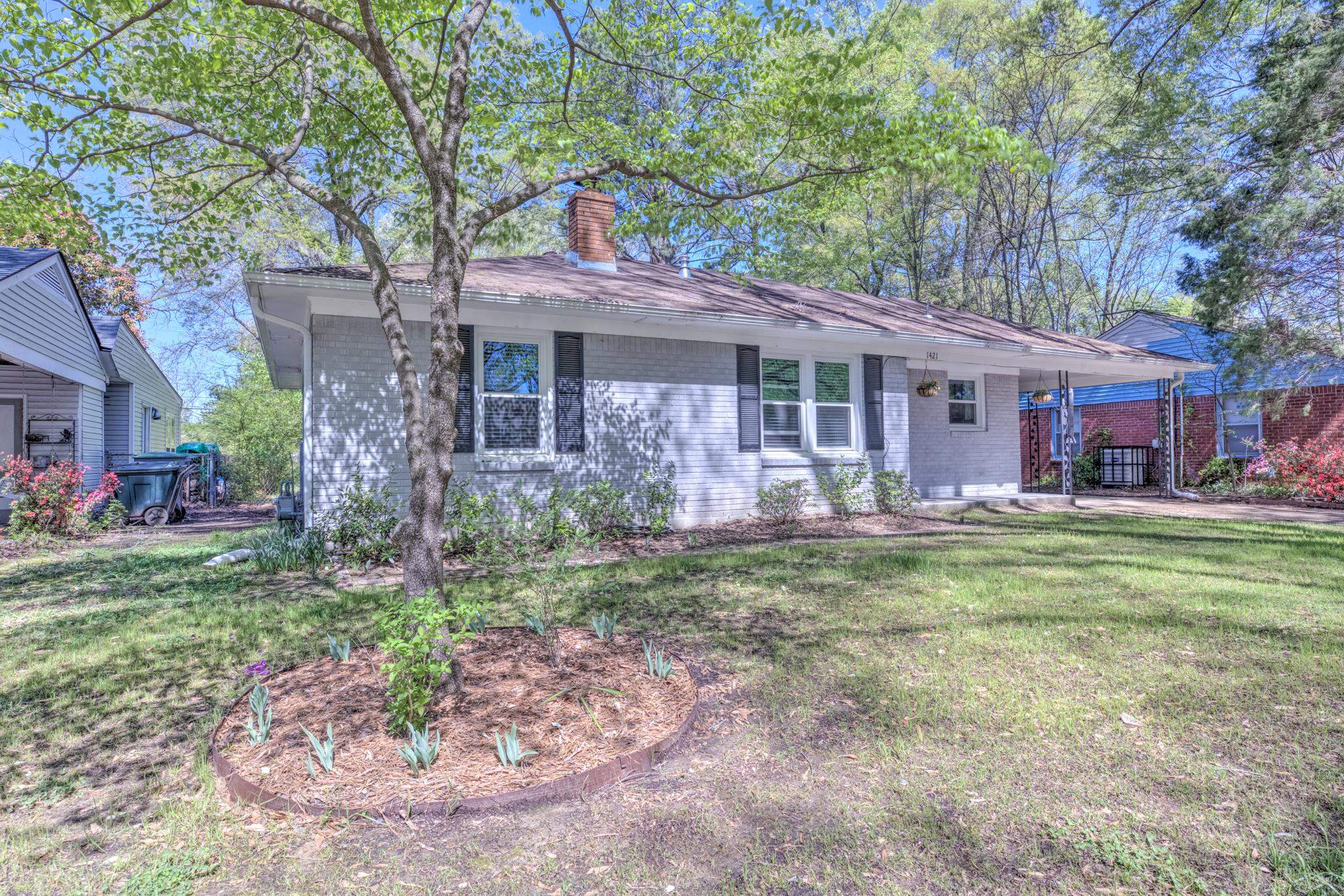 1421 Flamingo Road Memphis, TN 38117 - Photo 1 of 23 a front view of a house with garden