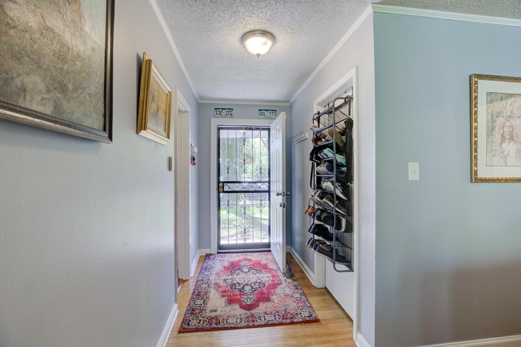 1421 Flamingo Road Memphis, TN 38117 - Photo 6 of 23 a view of a hallway to rooms and stairs