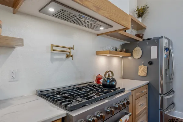 a view of a kitchen with washer and dryer