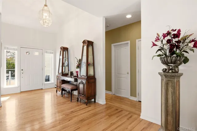 a view of a room with furniture and wooden floor