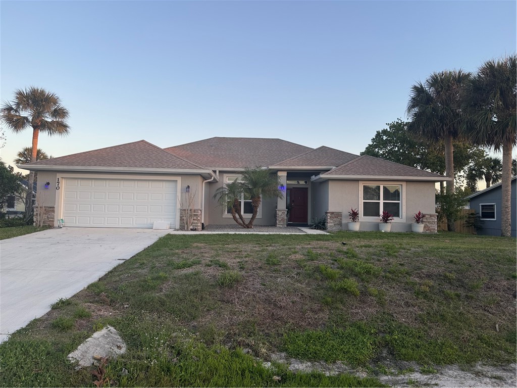 170 Coply Terrace Sebastian, FL 32958 - Photo 1 of 25 a front view of a house with a garden