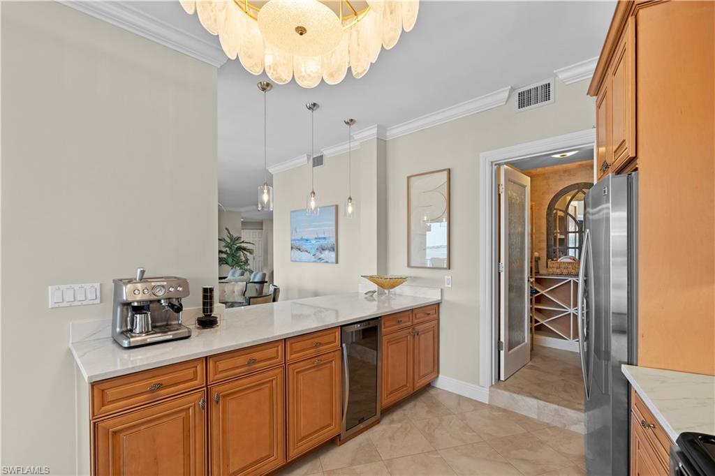 524 La Peninsula Boulevard, Unit 524 Naples, FL 34113 - Photo 19 of 44 a spacious bathroom with a sink double vanity and a mirror