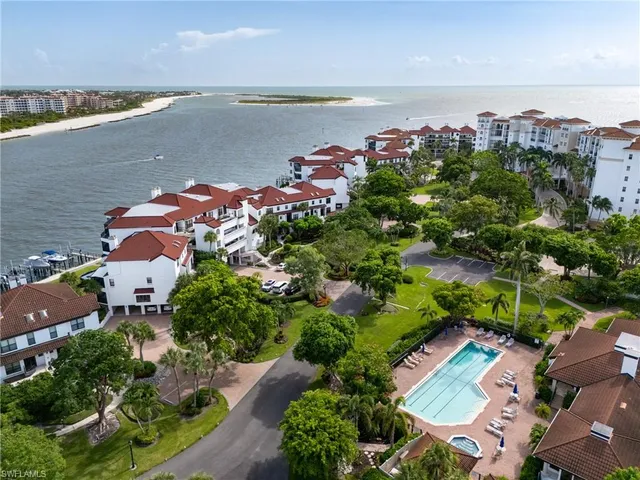 an aerial view of a house with a lake view
