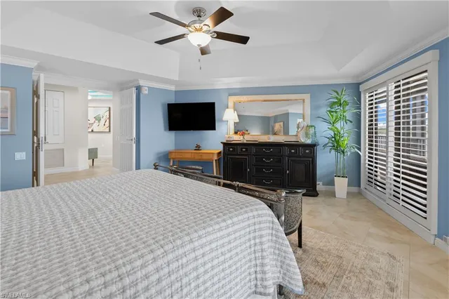 a bathroom with double vanity and a window