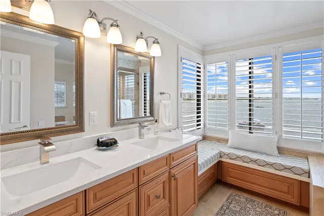 a bathroom with a granite countertop sink a toilet and shower