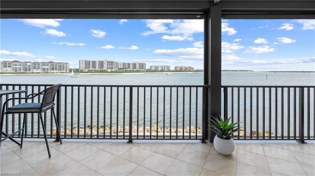 524 La Peninsula Boulevard, Unit 524 Naples, FL 34113 - Photo 40 of 44 a view of a balcony with a potted plant