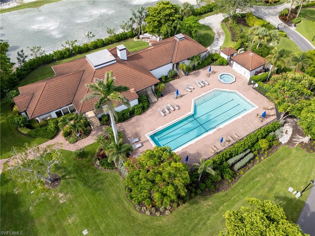 524 La Peninsula Boulevard, Unit 524 Naples, FL 34113 - Photo 42 of 44 an aerial view of a house with a garden