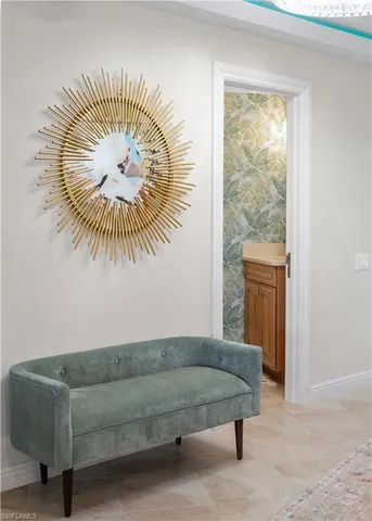 a living room with a bed and a table