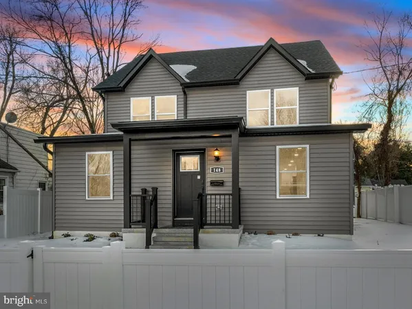 a front view of a house with garage