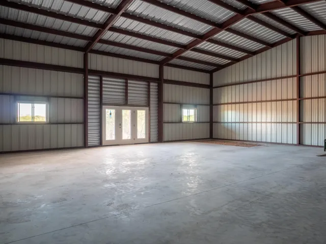 a view of an empty room with a fireplace