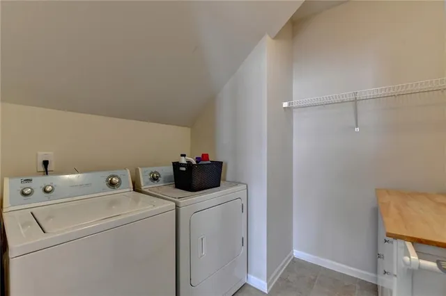 a view of storage and utility room with washer and dryer