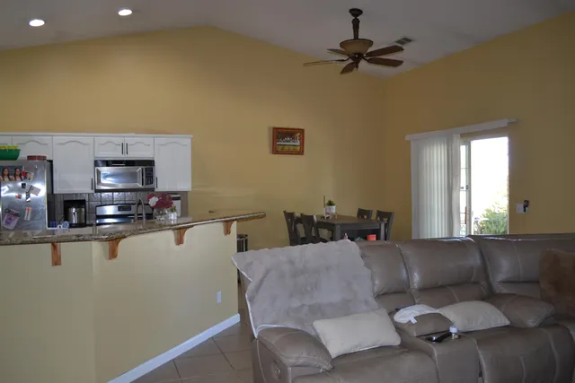 a dining room with a table and chairs