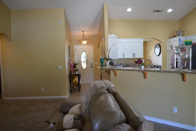 a view of a livingroom with a dining table and a fire place